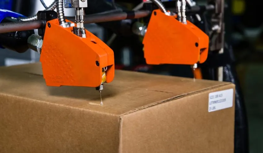 Máy phun keo cho vật liệu giấy và carton May phun keo cho vat lieu giay va carton